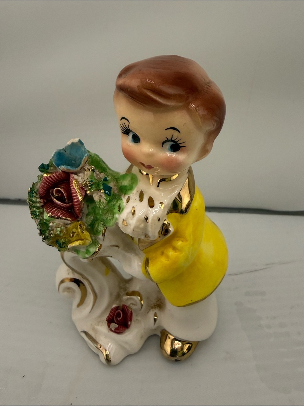 Yellow Ceramic Vintage-Style Boy Figurine with Floral Bouquet
